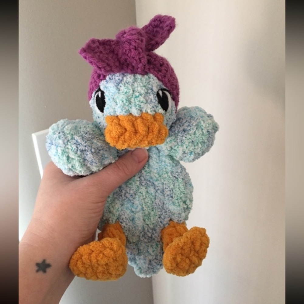 Handmade crochet baby duck snuggler